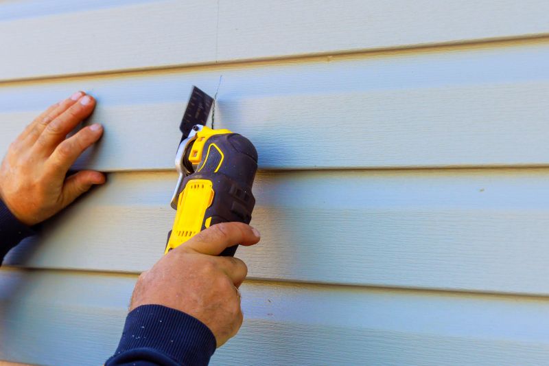 Expert Vinyl Siding Repair in Action